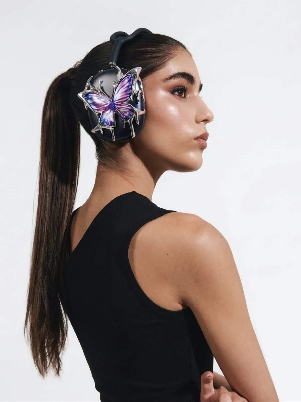 Model wearing the purple butterfly piece, seen in profile